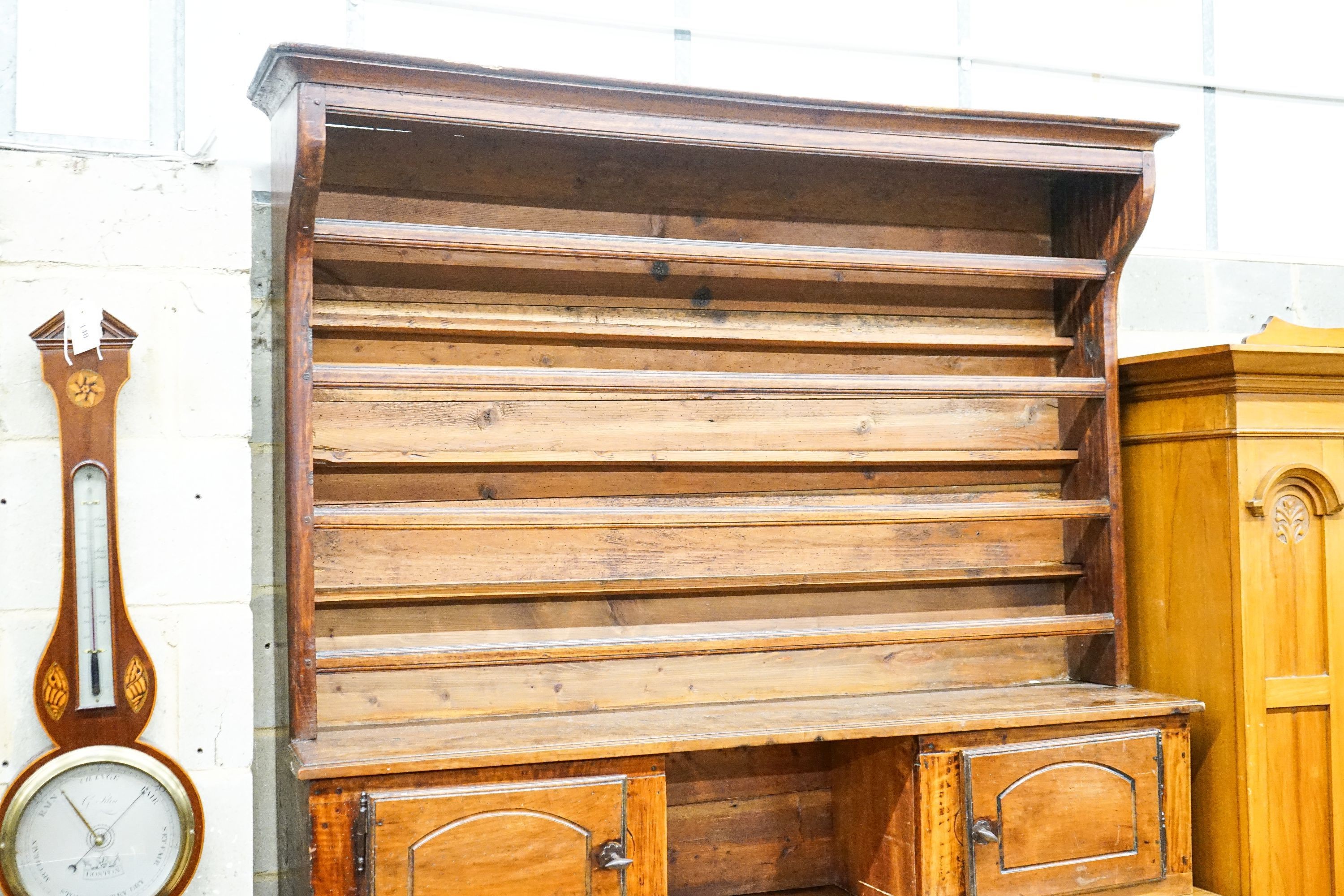 A late 18th / early 19th century French fruitwood dresser, length 160cm, depth 57cm, height 240cm